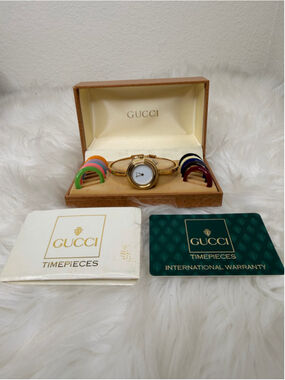 Gucci 11/12.2 Interchangeable Bezel Bangle Watch, w/ 12 bezels, box & paperwork